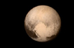 Pluto up close: Spacecraft achieves flyby, then calls home
